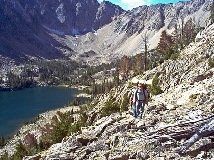 quiet lake white clouds wilderness